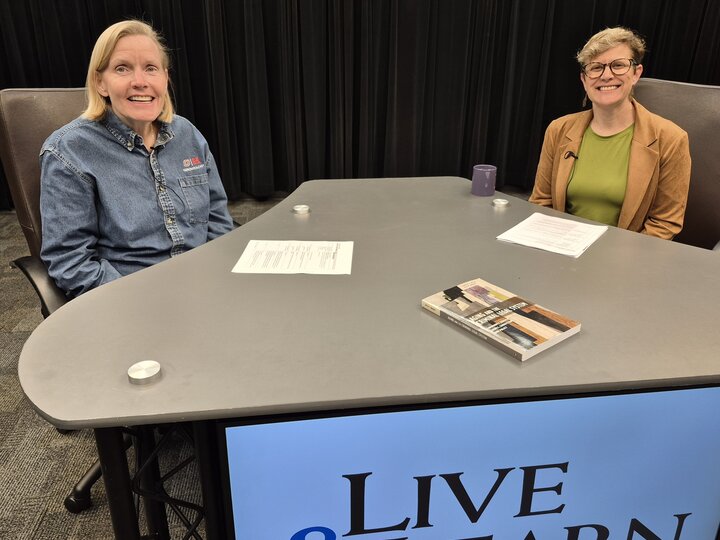 Dr. Masters and Dr. Wylie at Live & Learn desk