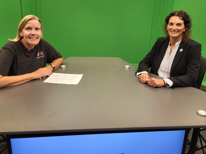 Julie Masters and Dr. Sara Myers at the Live & Learn desk